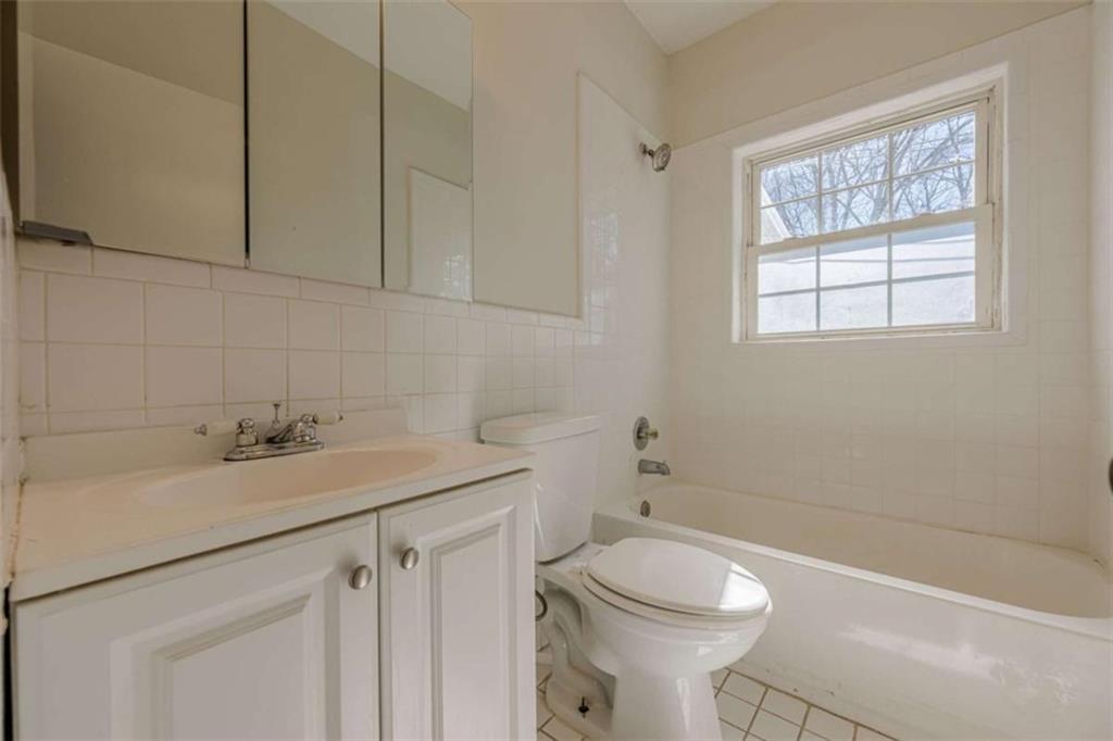 1977 North Decatur Road Atlanta, GA 30307 - Photo 40 of 59 a bathroom with a sink a toilet and a bathtub
