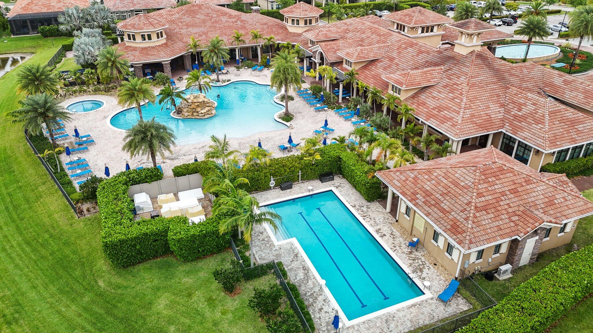 8887 Leon Circle Parkland, FL 33076 - Photo 41 of 54 an aerial view of a house with a garden