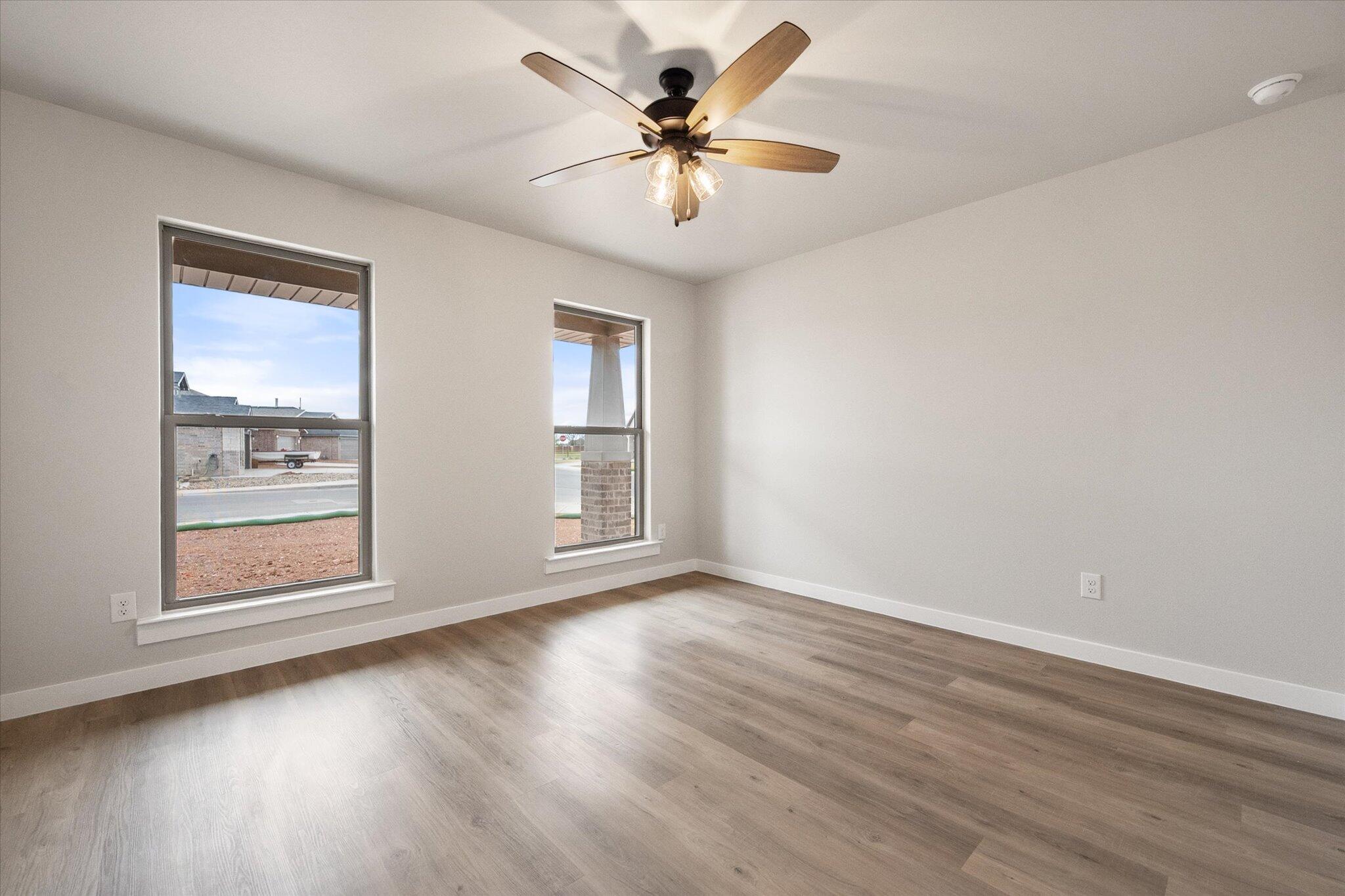 2332 136th Street Lubbock, TX 79423 - Photo 15 of 19 wooden floor in an empty room with a window