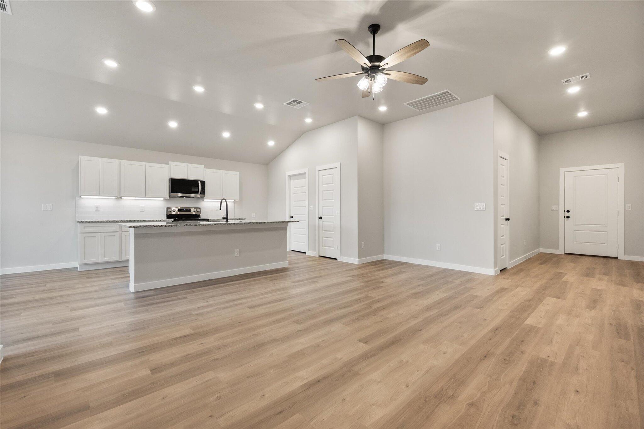 2332 136th Street Lubbock, TX 79423 - Photo 6 of 19 a view of kitchen with sink and refrigerator