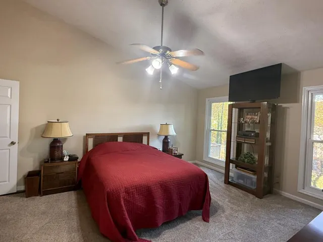 a bathroom with a tub shower and sink