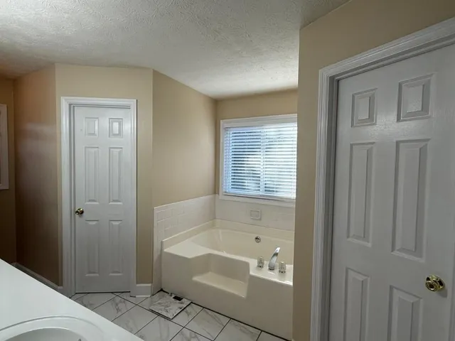 a bathroom with a sink double vanity and a mirror