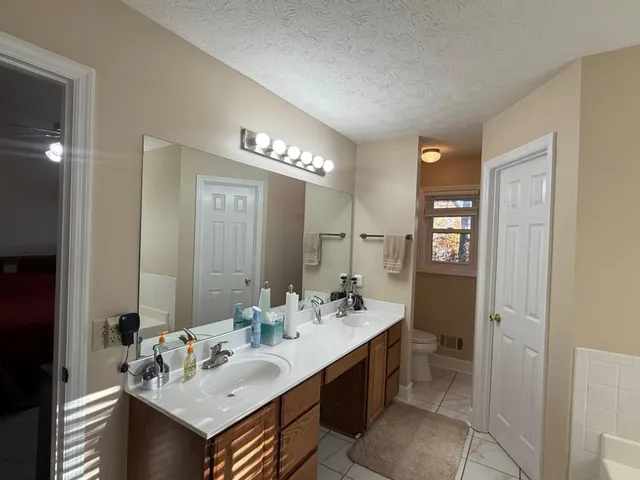 a bathroom with a glass shower door