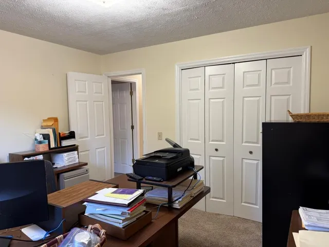 a view of a chair and table in the balcony