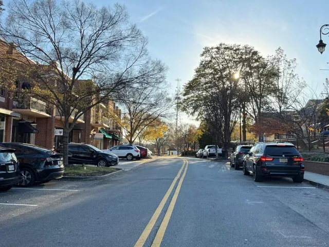 a view of street with parked cars
