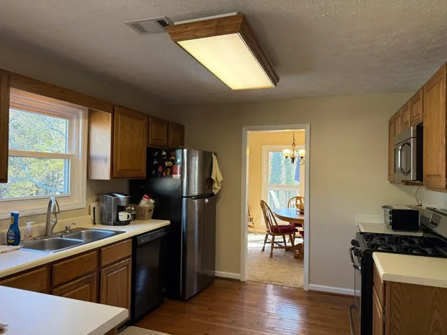 a kitchen with sink cabinets and window