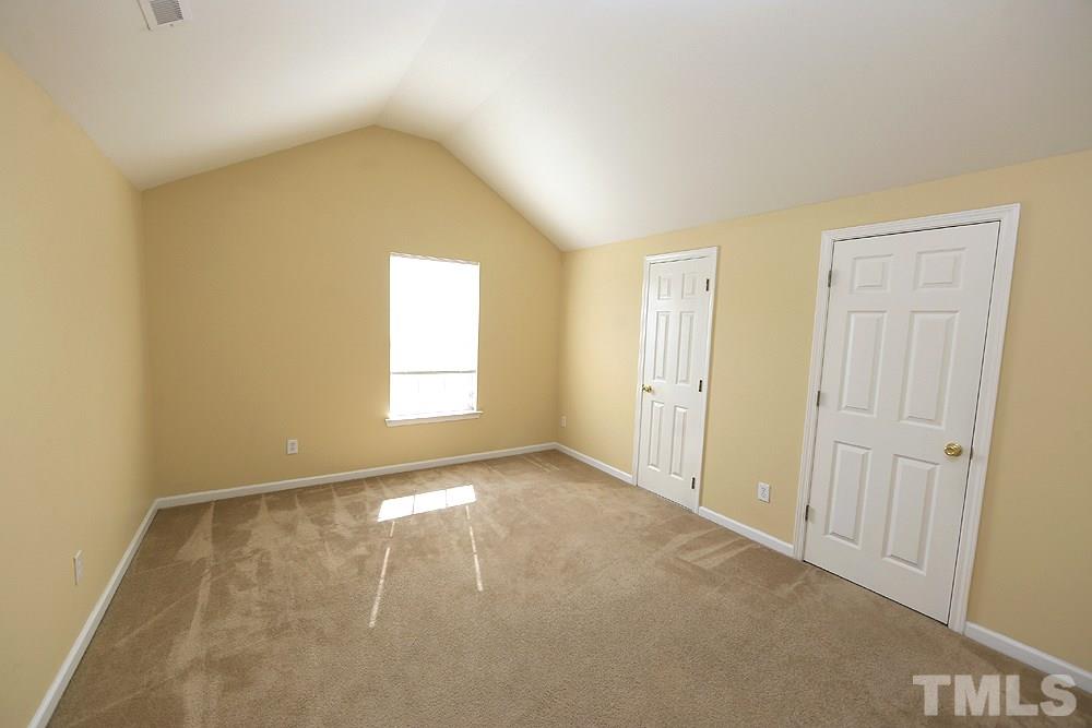 1520 Cricket Ridge Drive Raleigh, NC 27610 - Photo 14 of 18 1st of 3 second floor bedrooms with cathedral ceiling and 2 walk-in attic storage areas.