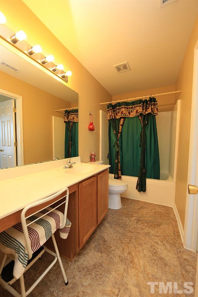 1520 Cricket Ridge Drive Raleigh, NC 27610 - Photo 15 of 18 With new water saver toilet.