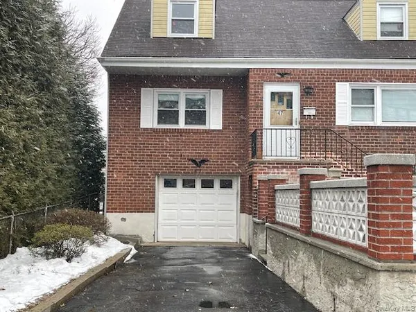 a front view of a house with stairs