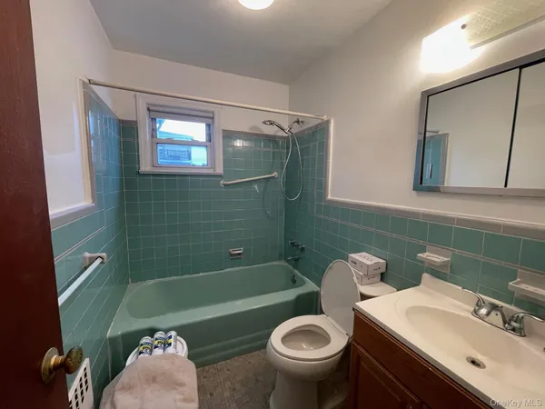 a bathroom with a sink toilet and a bathtub