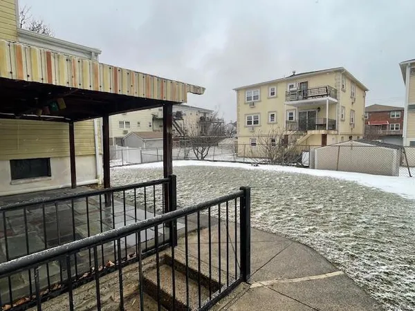 a view of a living room and kitchen with a large window