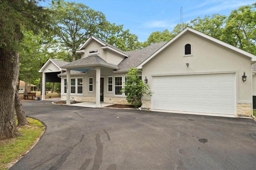 Front view of this incredible like new one story custom home!