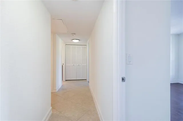 a view of a lake with a city skyline in the background