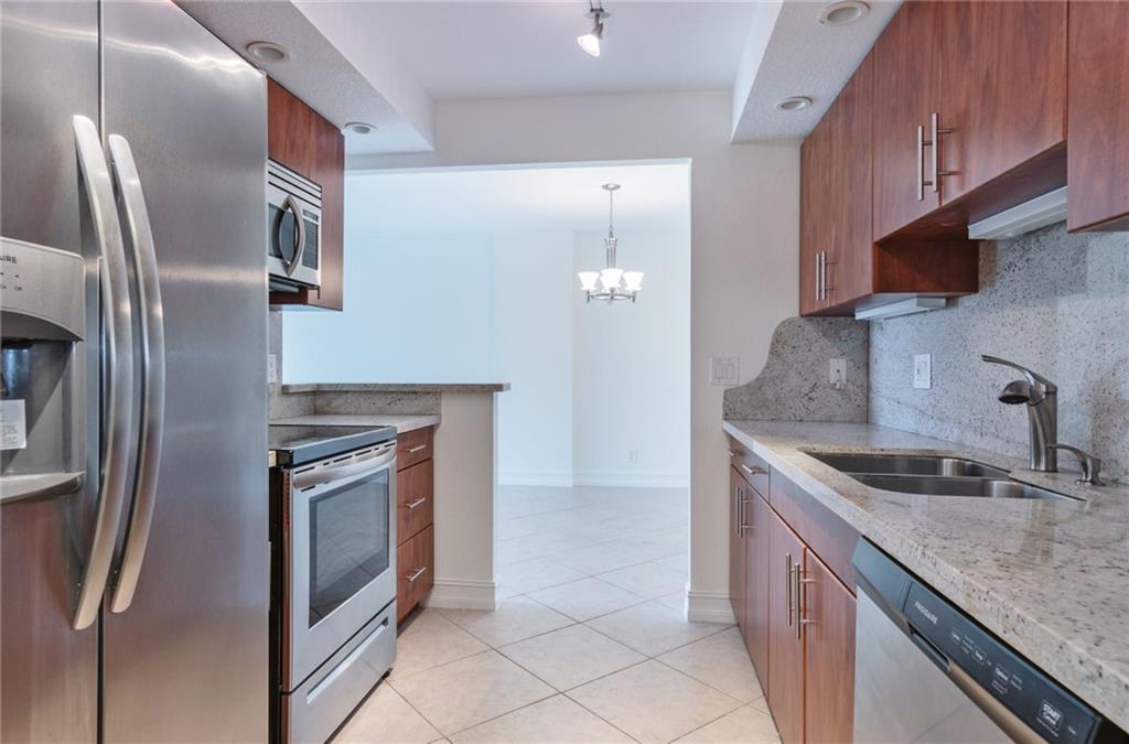 950 Ponce De Leon Road, Unit 408 Boca Raton, FL 33432 - Photo 2 of 50 a kitchen with stainless steel appliances granite countertop a sink stove and refrigerator