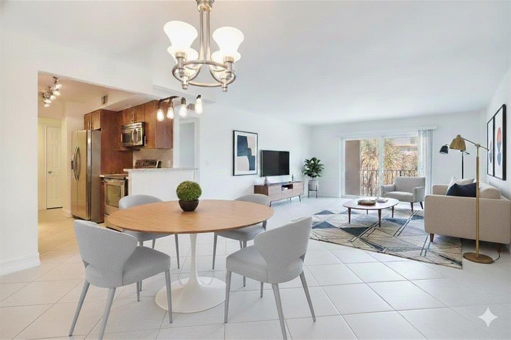 950 Ponce De Leon Road, Unit 408 Boca Raton, FL 33432 - Photo 3 of 50 a dining room filled chandelier and kitchen view