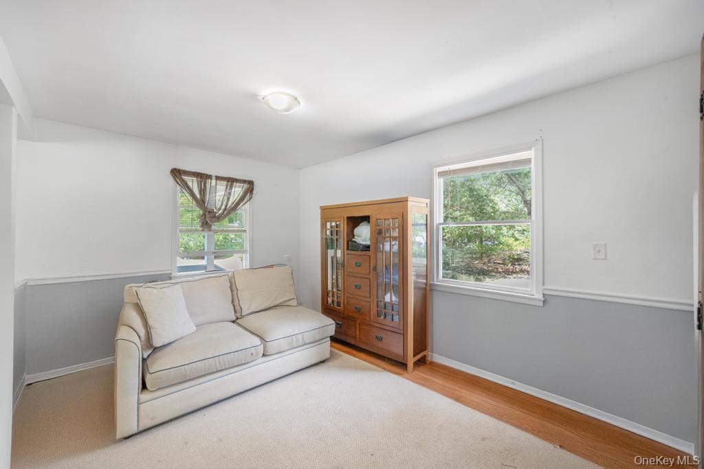 4 Cooks Lane Westhampton, NY 11977 - Photo 15 of 33 Living area with healthy amount of natural light and wood finished floors
