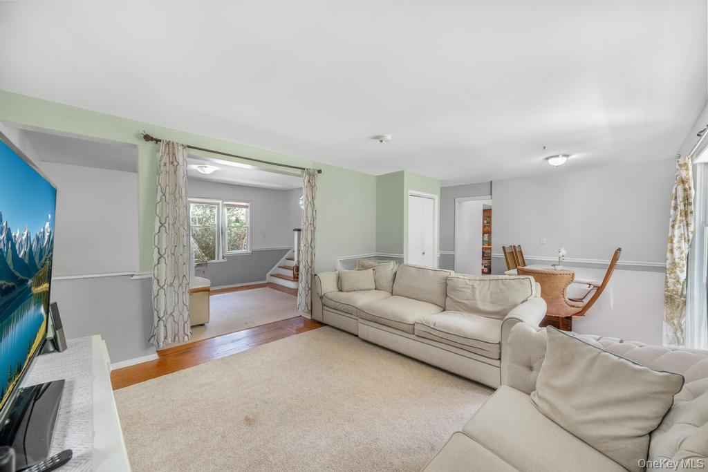 4 Cooks Lane Westhampton, NY 11977 - Photo 17 of 33 Living area with stairs and wood finished floors