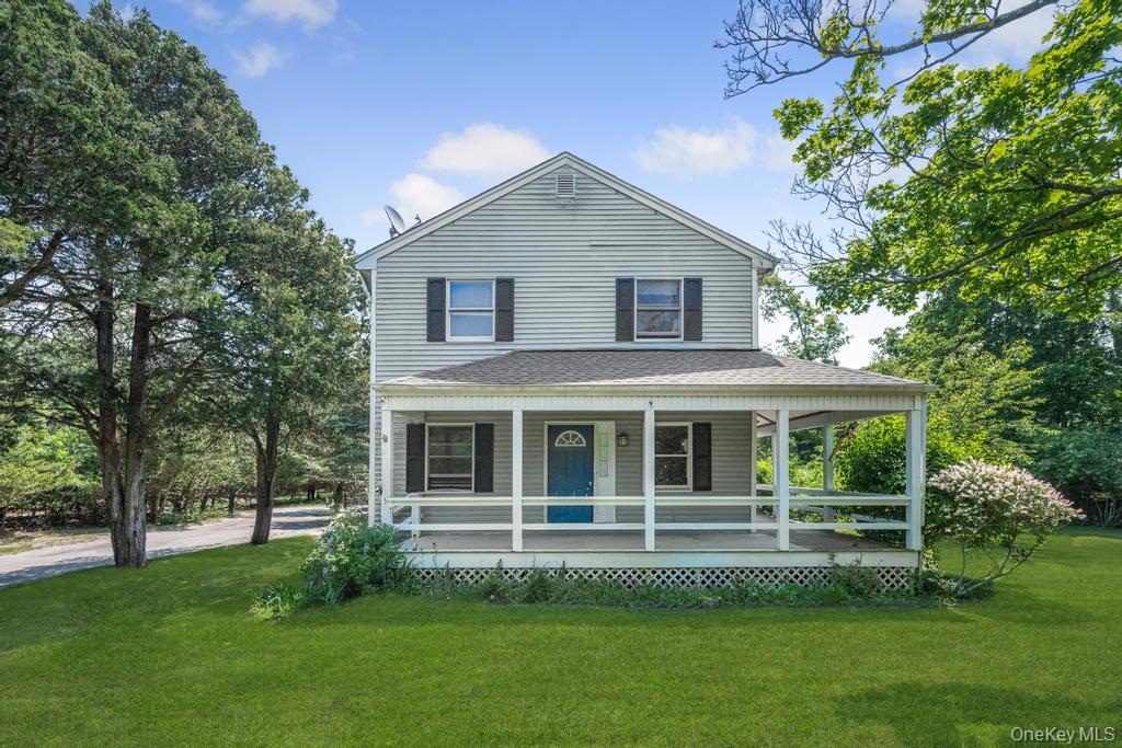 4 Cooks Lane Westhampton, NY 11977 - Photo 2 of 33 Farmhouse inspired home featuring a porch, a front yard, and roof with shingles