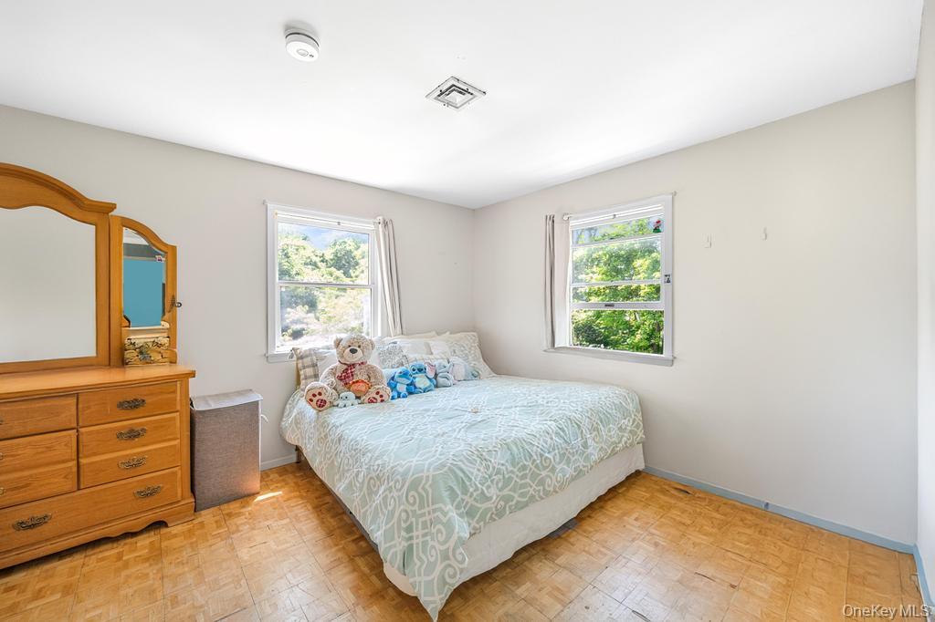 4 Cooks Lane Westhampton, NY 11977 - Photo 29 of 33 Bedroom with light flooring and baseboards