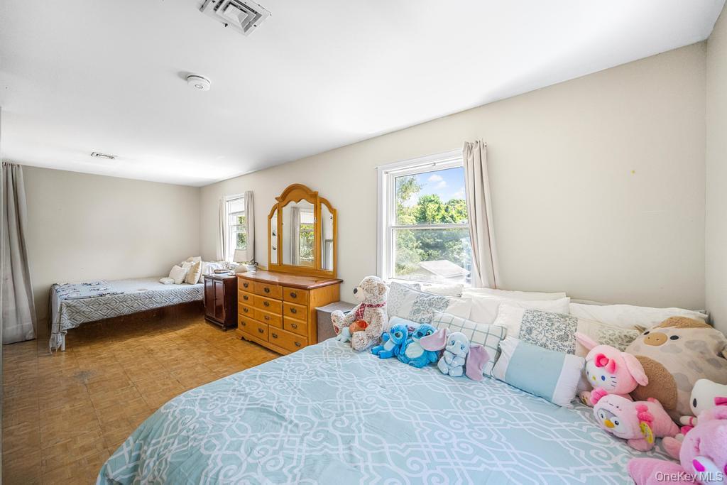 4 Cooks Lane Westhampton, NY 11977 - Photo 30 of 33 Bedroom with multiple windows