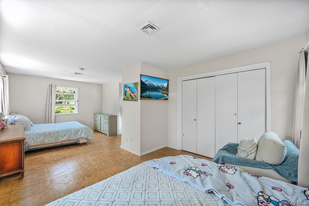 4 Cooks Lane Westhampton, NY 11977 - Photo 31 of 33 Bedroom featuring a closet and baseboards