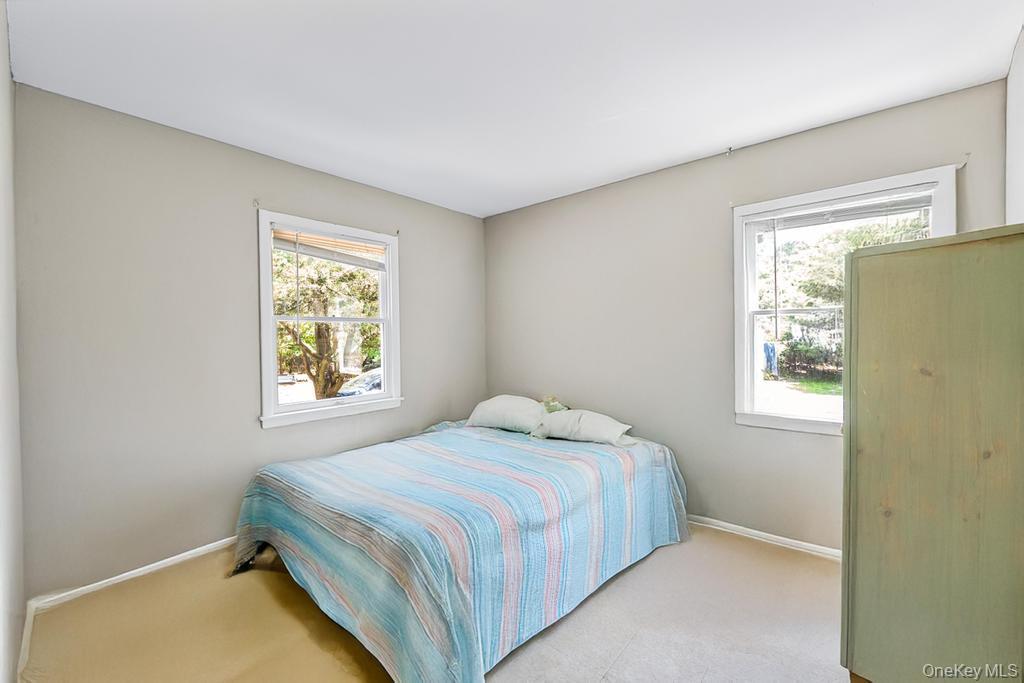 4 Cooks Lane Westhampton, NY 11977 - Photo 32 of 33 Bedroom with light carpet and baseboards