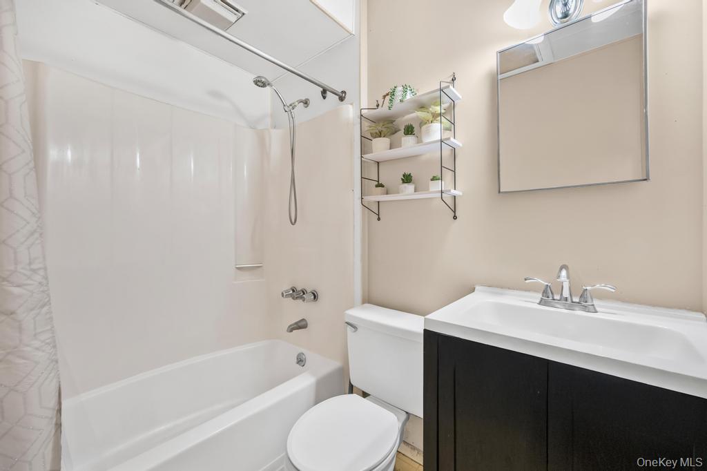 4 Cooks Lane Westhampton, NY 11977 - Photo 33 of 33 Full bath featuring shower / bath combo with shower curtain and vanity