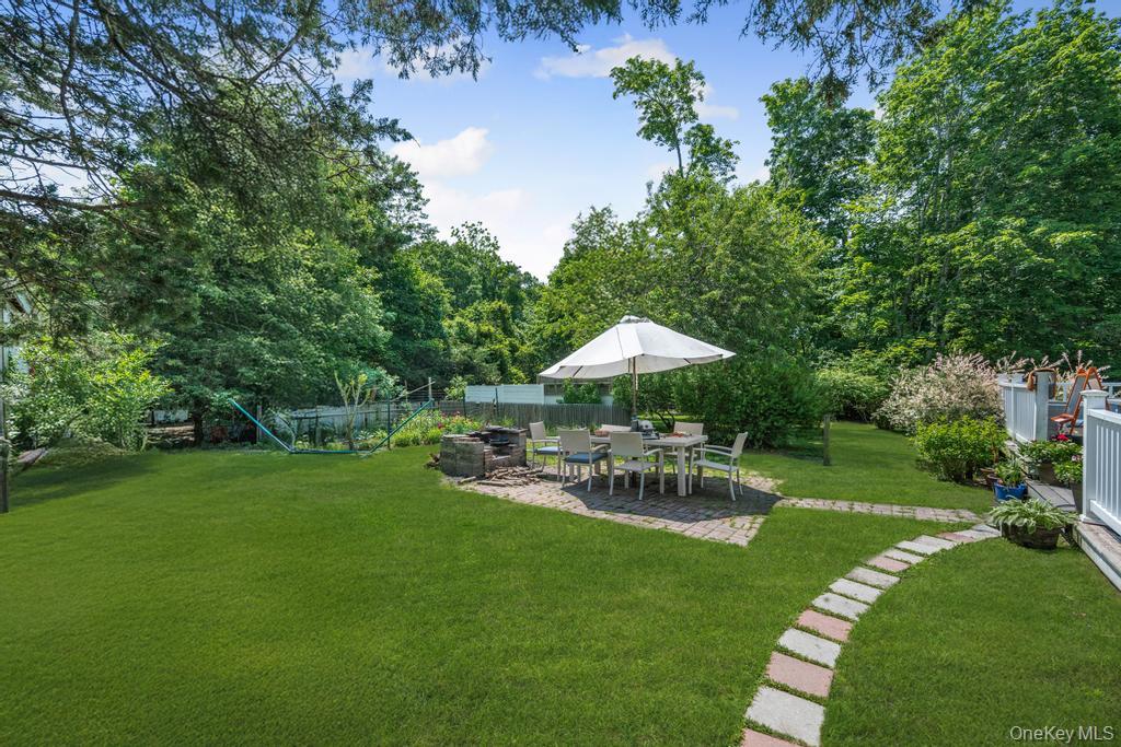 4 Cooks Lane Westhampton, NY 11977 - Photo 9 of 33 View of yard featuring a patio and a fire pit