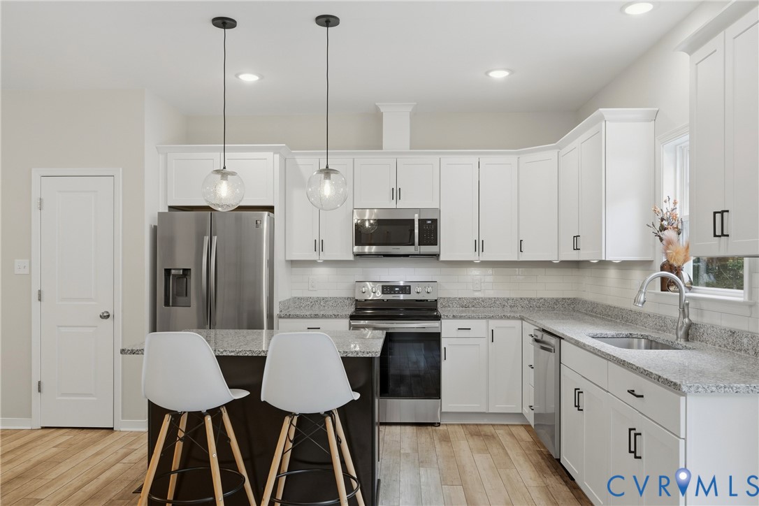 3741 Boundary Run Road Gum Spring, VA 23065 - Photo 13 of 36 Modern kitchen featuring white shaker cabinetry, s