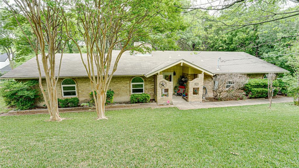 a view of a house with a yard porch and sitting area