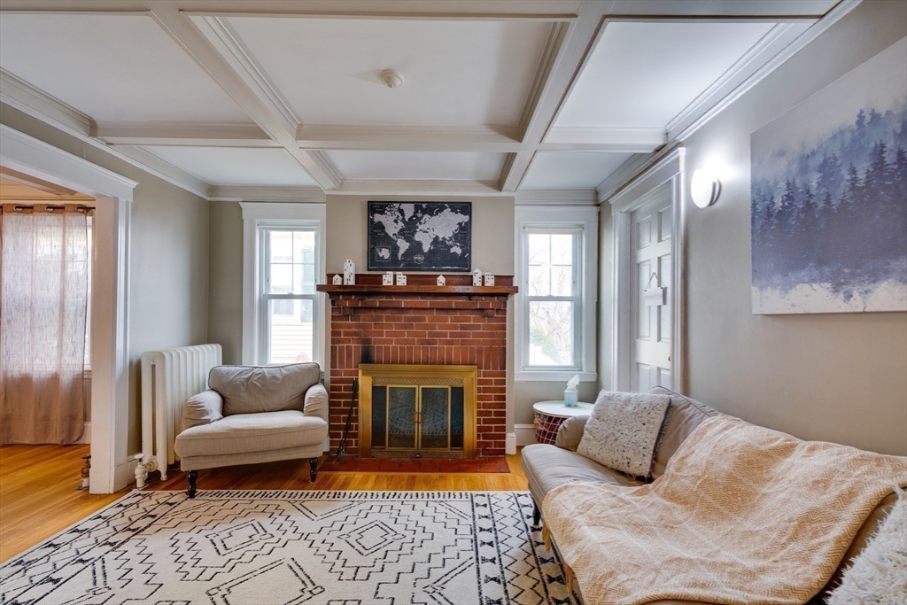 30 Kilsythe Road Arlington, MA 02476 - Photo 10 of 31 a living room with furniture and a fireplace