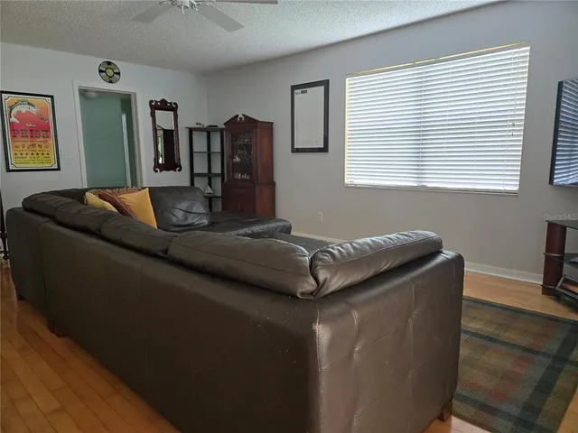 a living room with furniture and window