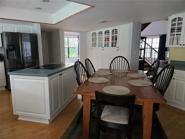 a dining room with furniture and window