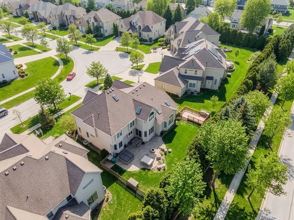 an aerial view of residential house with swimming pool