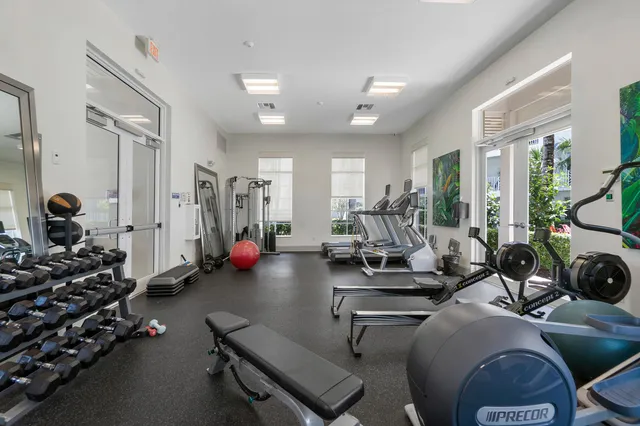 a kitchen with a sink cabinets stainless steel appliances and a window