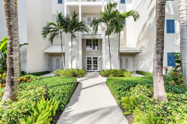 a view of a room with wooden floor windows and chandelier