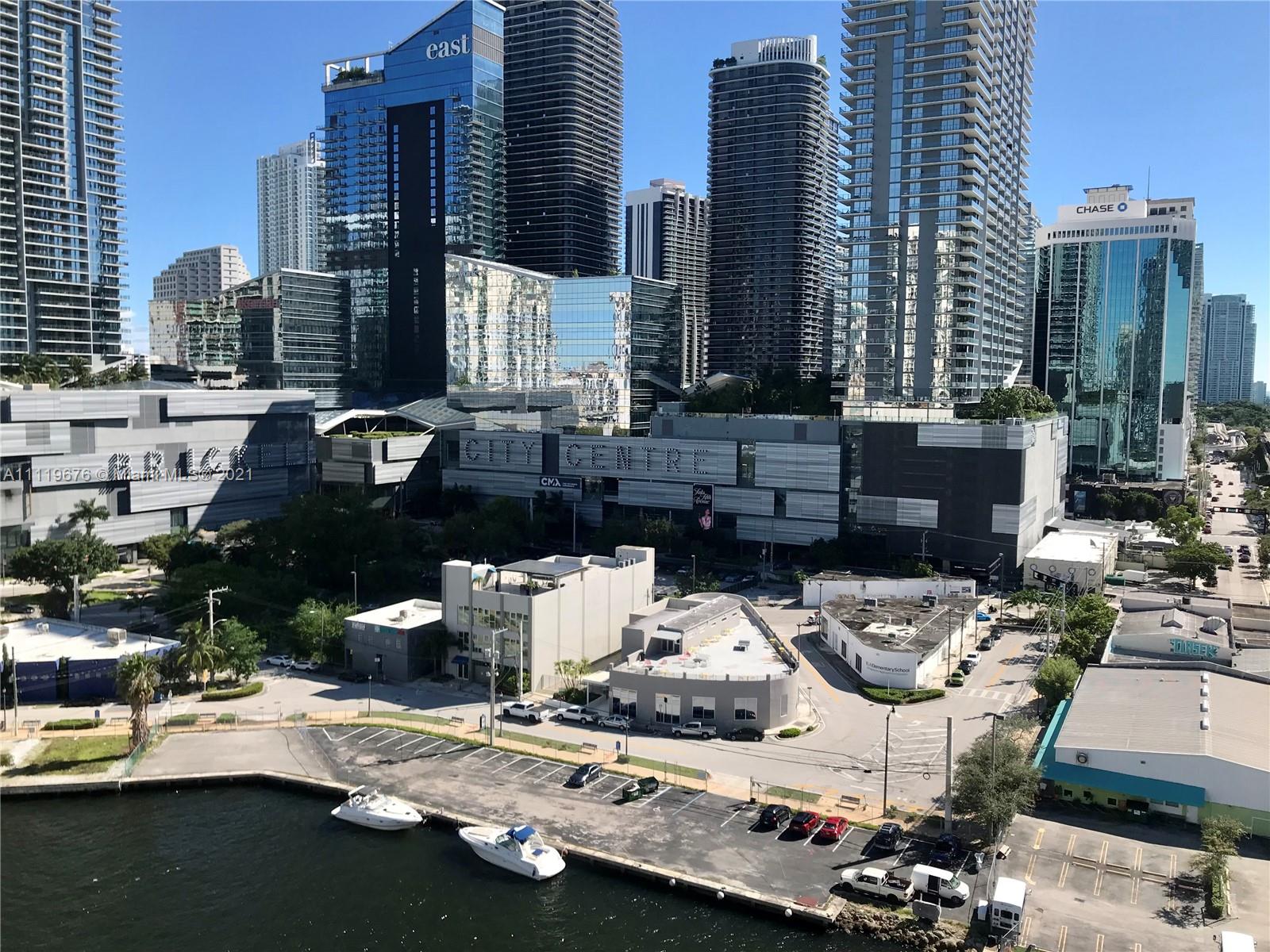 92 Southwest 3rd Street, Unit 1503 Miami, FL 33130 - Photo 14 of 14 a view of a city with patio