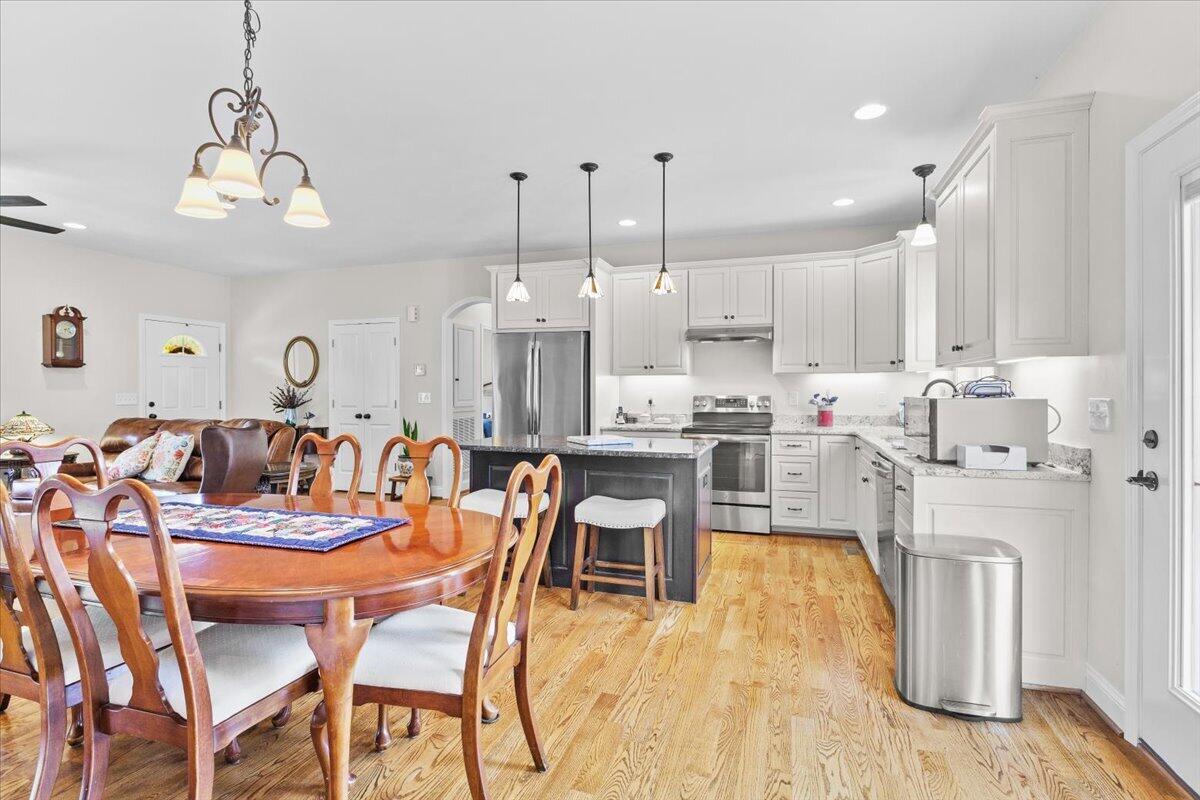 4133 Grove Hill Road Fincastle, VA 24090 - Photo 12 of 66 a large kitchen with a table and chairs