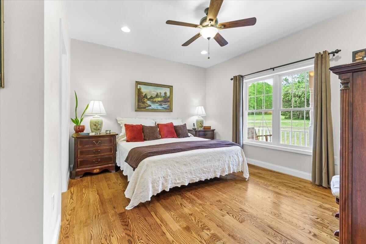 4133 Grove Hill Road Fincastle, VA 24090 - Photo 15 of 66 a bedroom with a bed and wooden floor