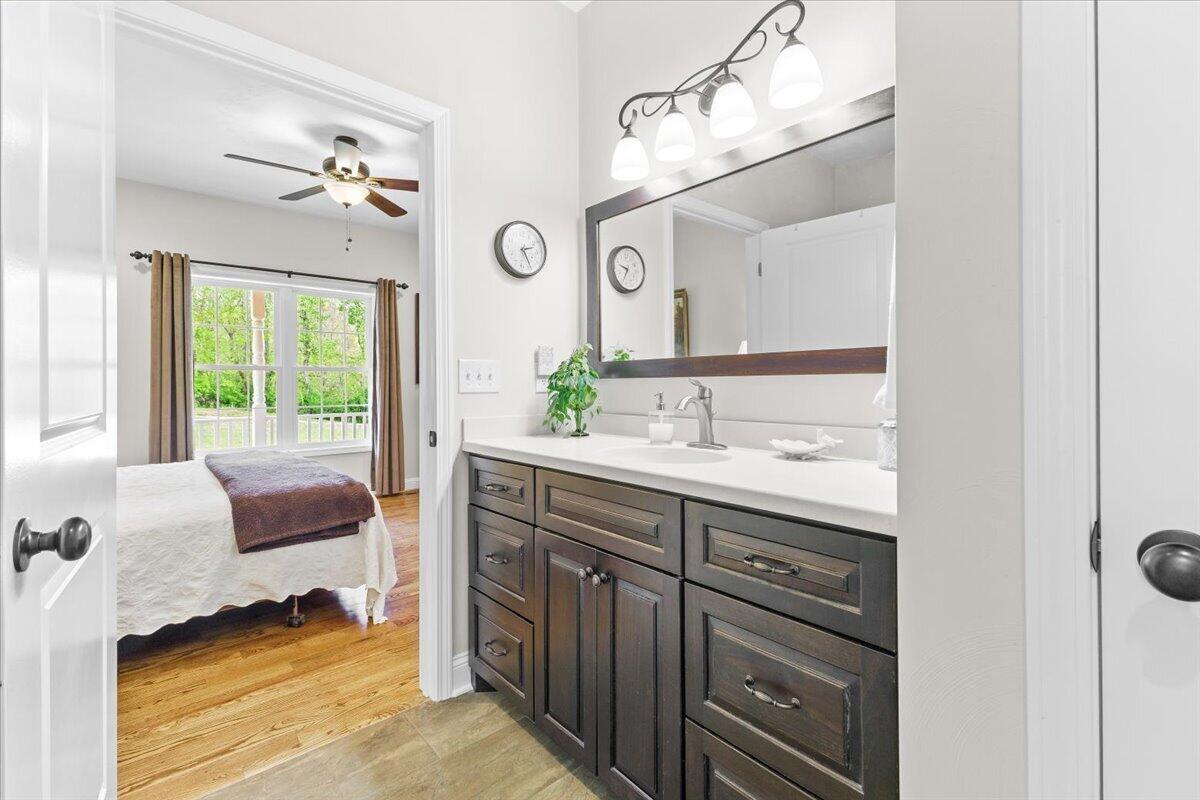 4133 Grove Hill Road Fincastle, VA 24090 - Photo 17 of 66 a spacious bathroom with a sink and a mirror