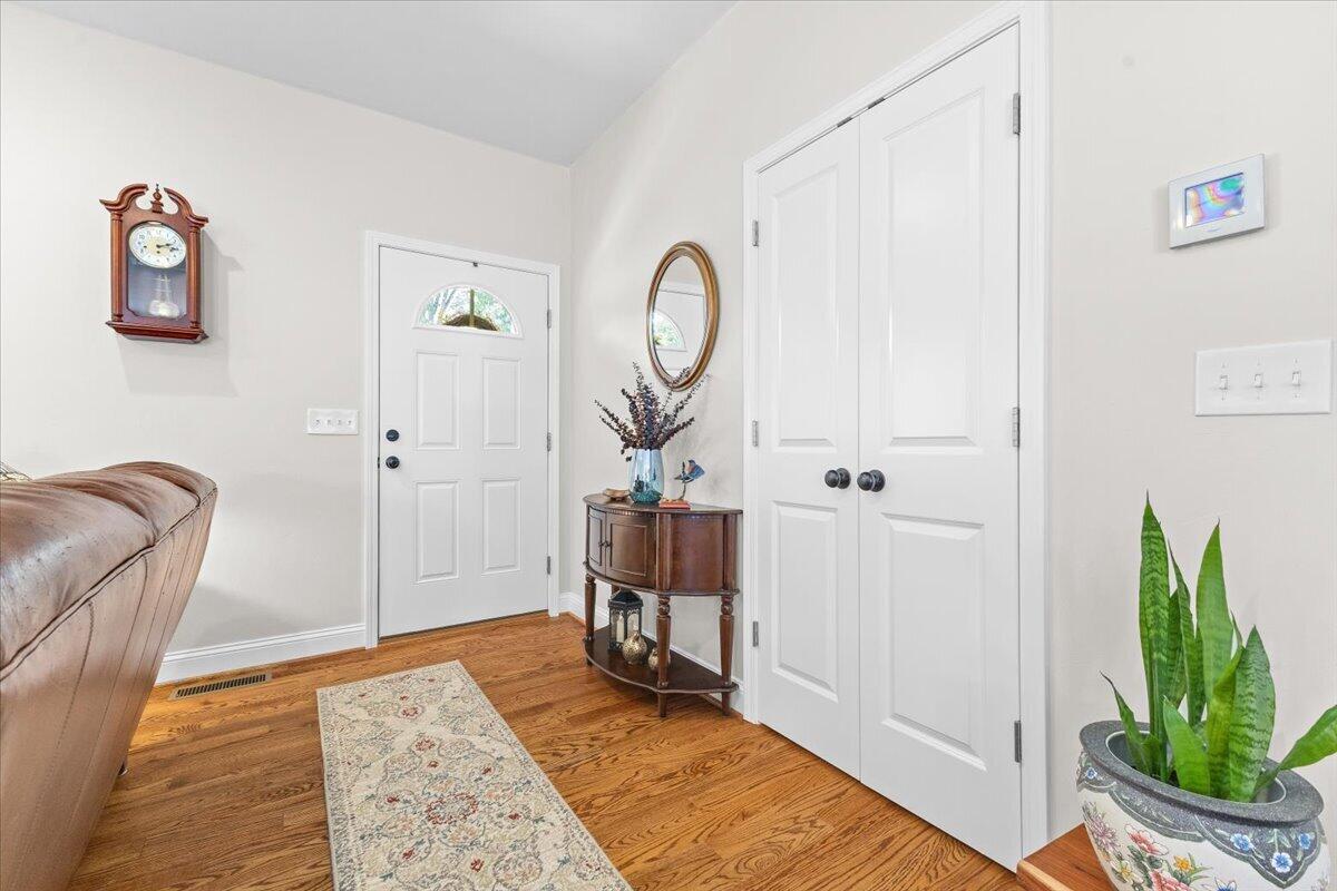 4133 Grove Hill Road Fincastle, VA 24090 - Photo 4 of 66 a bed room with a bed mirror and a window