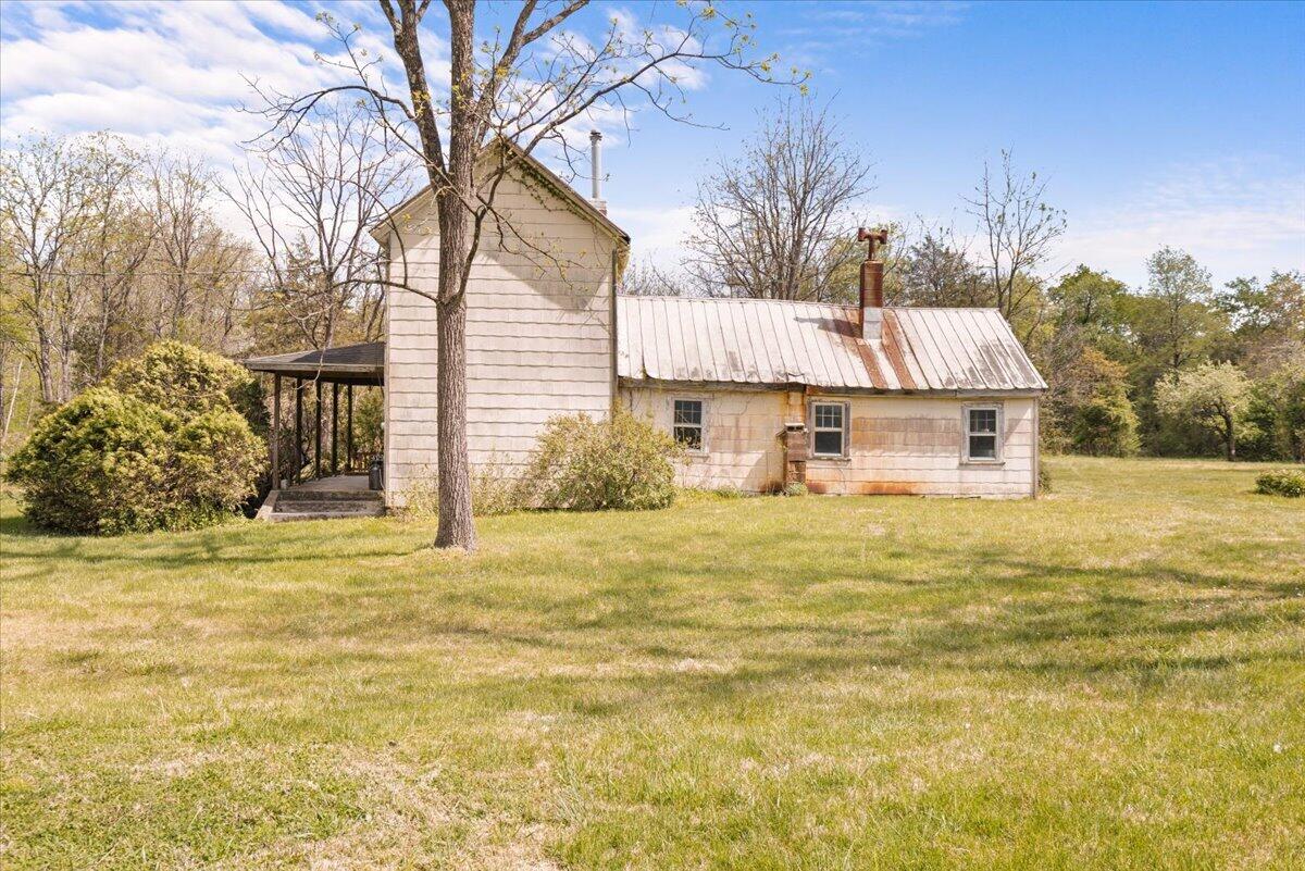4133 Grove Hill Road Fincastle, VA 24090 - Photo 41 of 66 a view of a house with backyard and tree