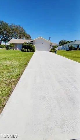 a view of a lake with a house in the background