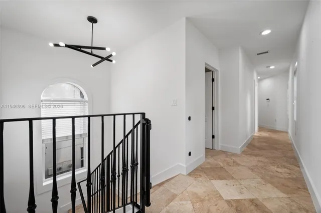 a view of a hallway with a window