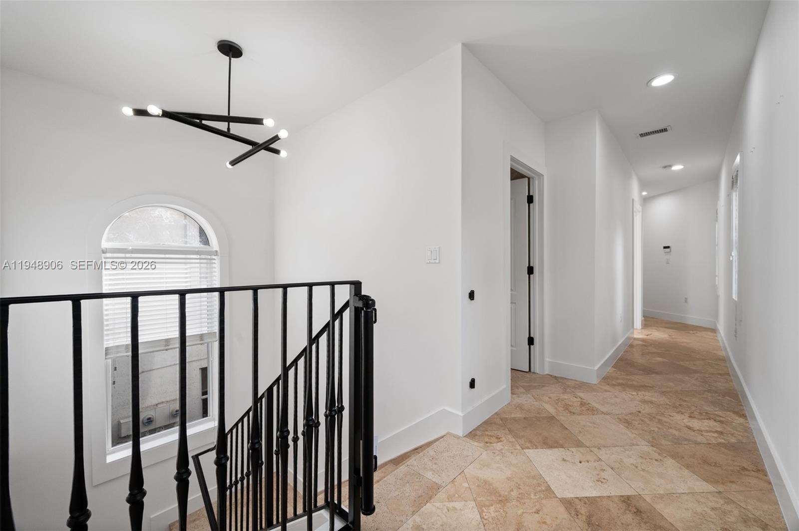 2922 Virginia Street, Unit 2922 Miami, FL 33133 - Photo 13 of 23 a view of a hallway with a window