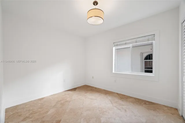 a view of a room with rack and exposed radiator