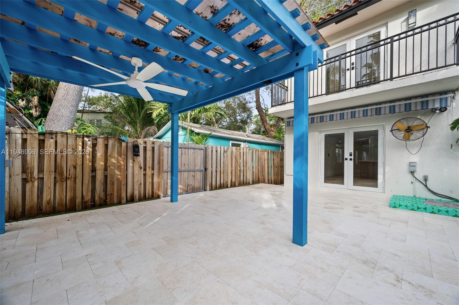2922 Virginia Street, Unit 2922 Miami, FL 33133 - Photo 21 of 23 a view of a house with porch and wooden fence