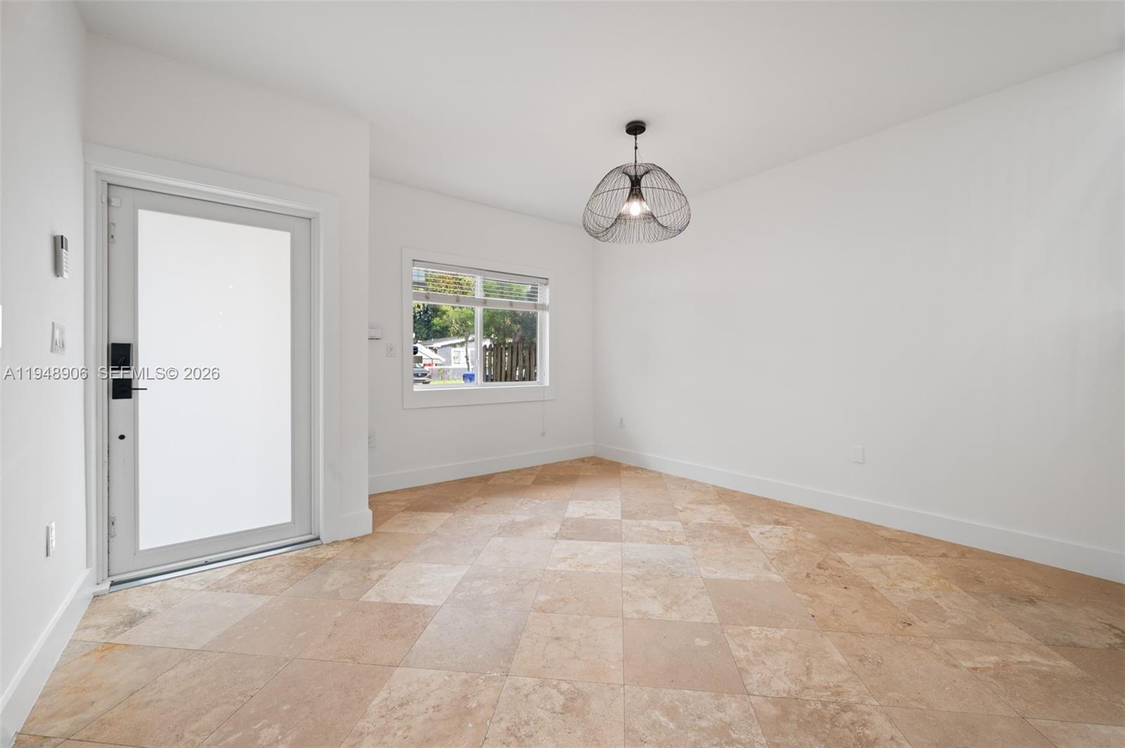 2922 Virginia Street, Unit 2922 Miami, FL 33133 - Photo 3 of 23 an empty room with windows and closet