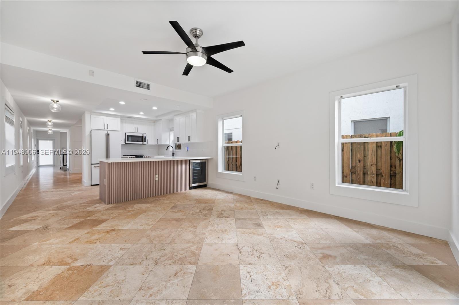 2922 Virginia Street, Unit 2922 Miami, FL 33133 - Photo 9 of 23 a view of a livingroom with a kitchen