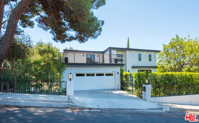 a view of a house with a street